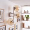 Modern three-light wall light Gastor with amber glass shades in vertical arrangement