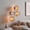 Modern globe wall light Koyoto with three amber glass shades on a sand-coloured metal bar
