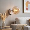 Modern Globe wall light Gastor with round amber glass shade and on/off switch