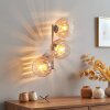 Modern Globe wall light Koyoto with three vertical amber-clear glass shades for the couch