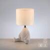 Leuchten Direkt beige table lamp TED, 3000 Kelvin warm white, seated-figure base