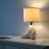 Leuchten Direkt beige table lamp TED, 3000 Kelvin warm white, seated-figure base