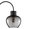 Brilliant Leuchten Arched floor lamp Ligari, curved arm, smoke-glass shade beside sofa